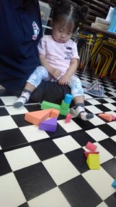 girl playing with blocks